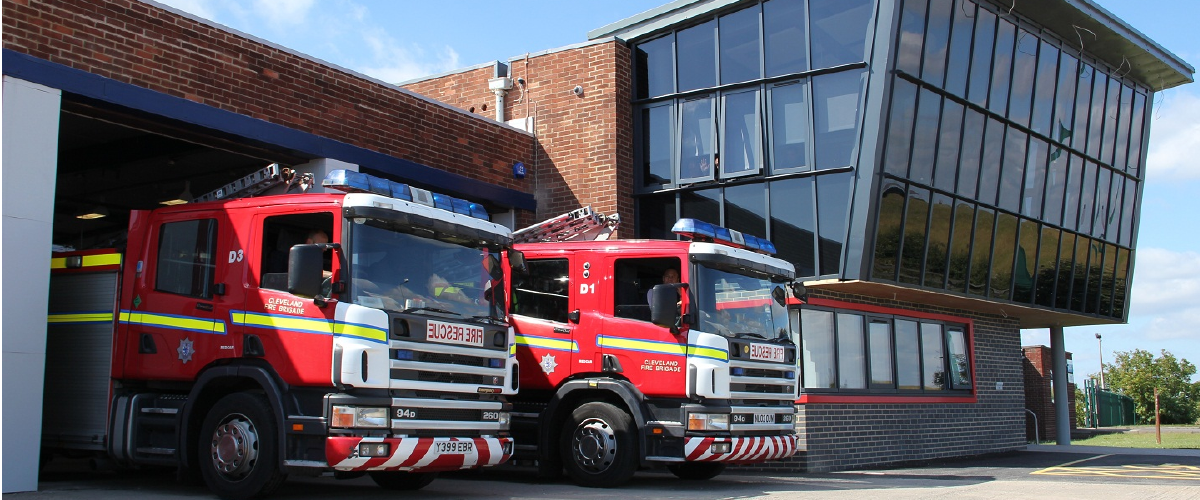 Outside of Redcar community fire station with a fire engines