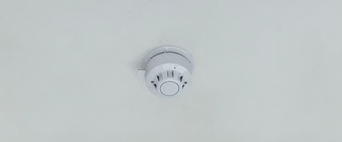 fire alarm located on a ceiling