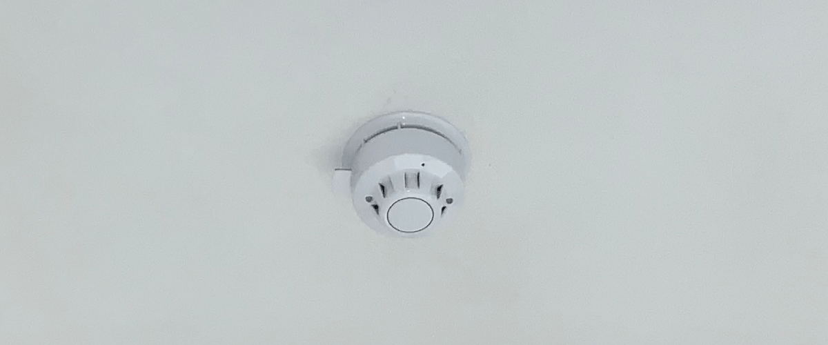 fire alarm located on a ceiling