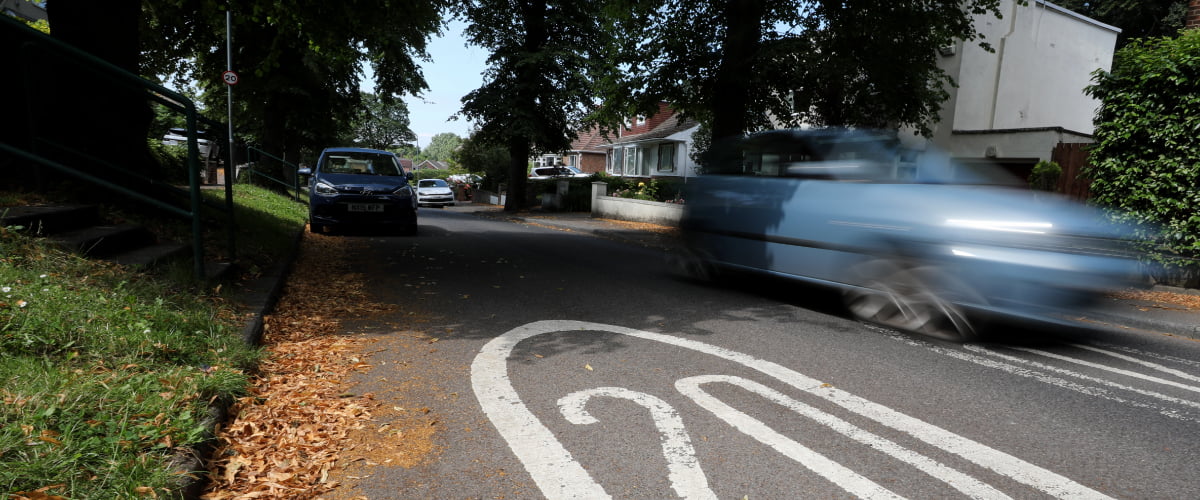 blurred car driving on 20mph road