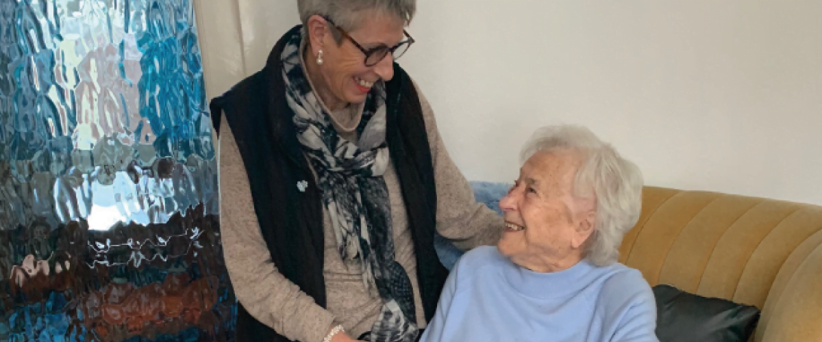 volunteer smiling down at befriending service user