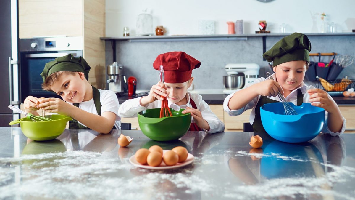 Three children cooking in the kitchen
