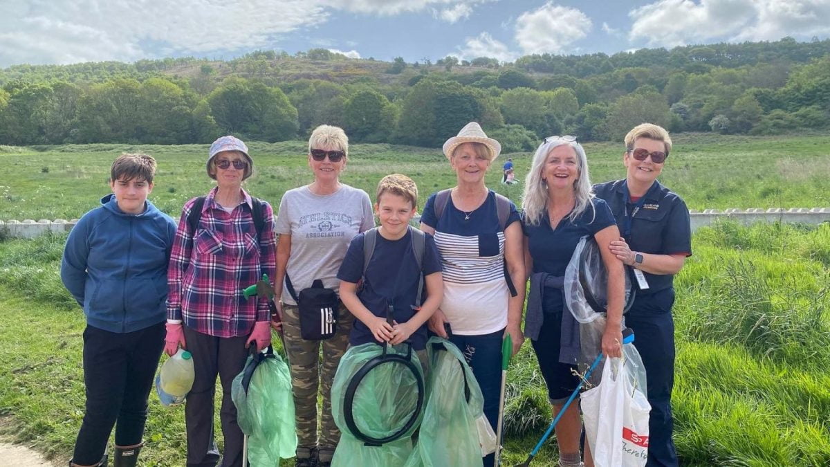 An image showing a group of people doing a litter pick