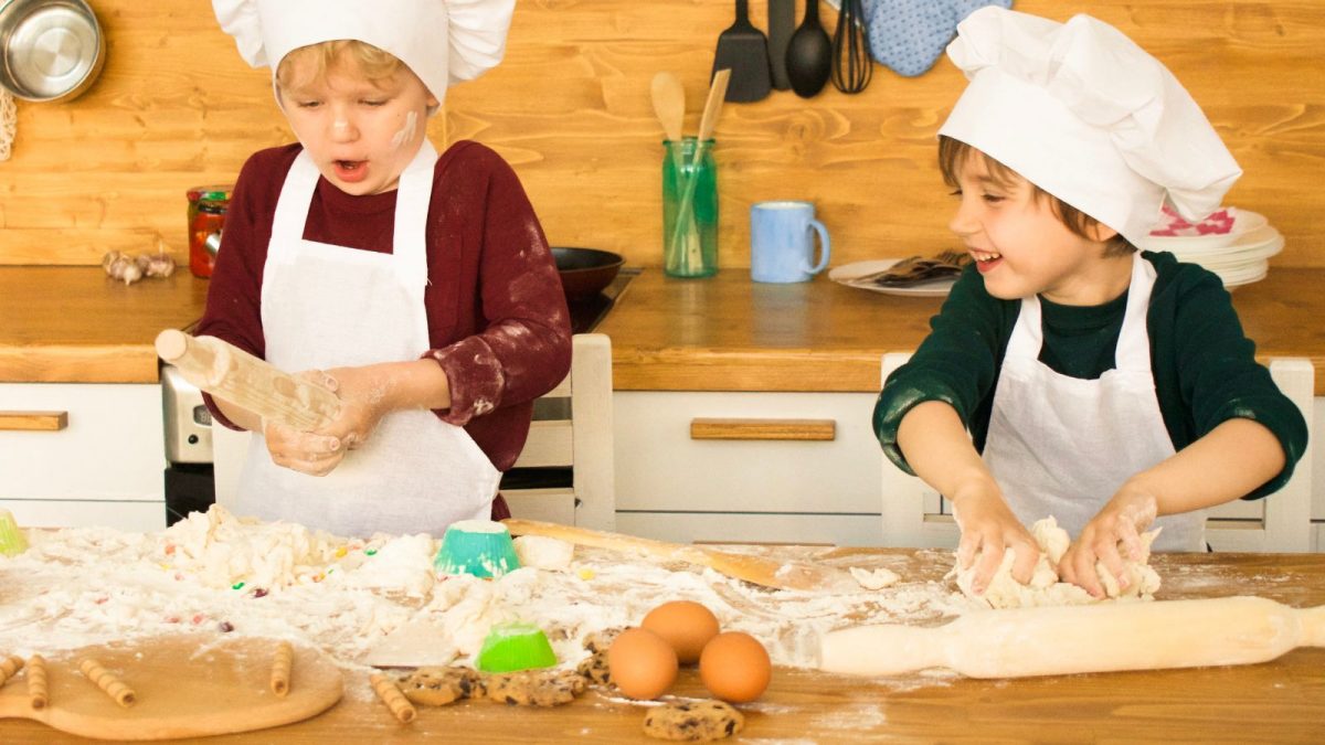 Two children baking in the kitch