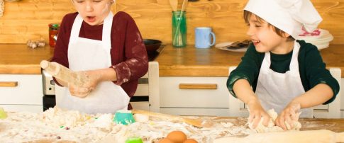 Two children baking in the kitch