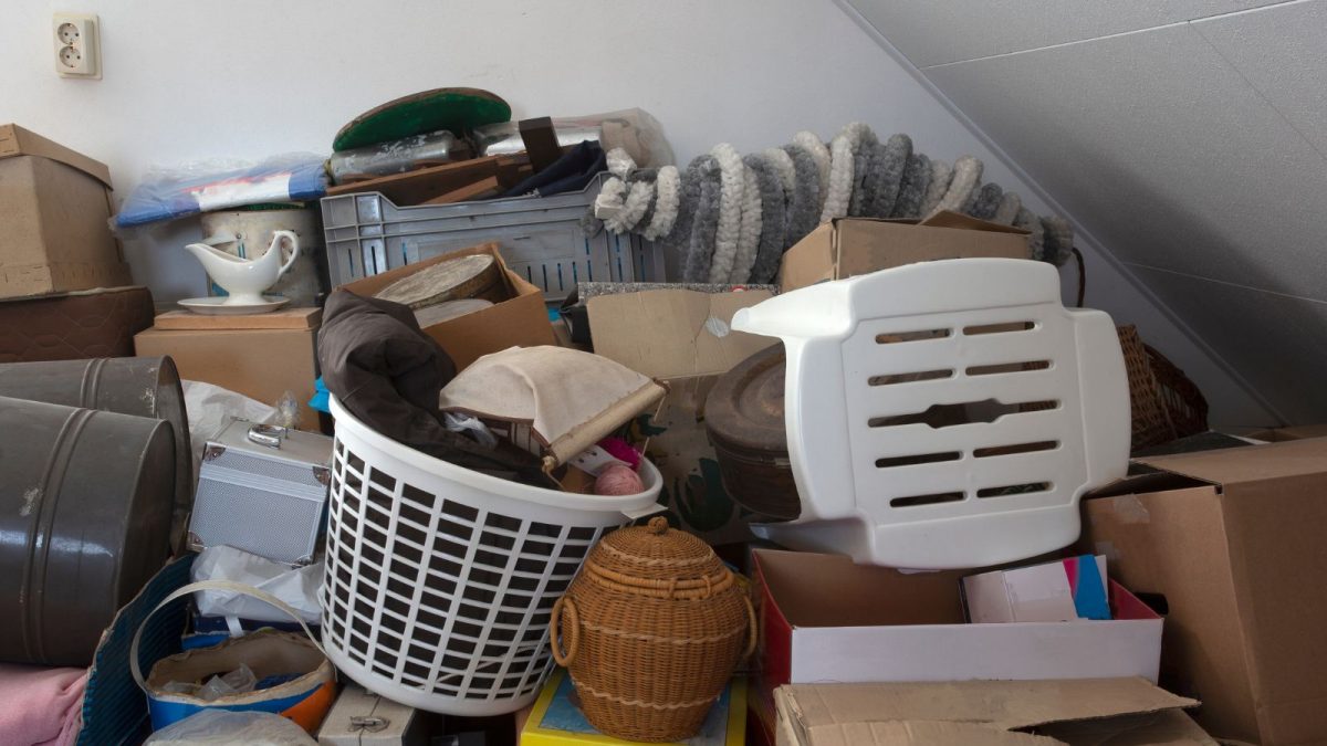 A room full of hoarded items such as boxes and washing baskets