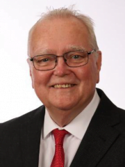 headshot of a male in a suit