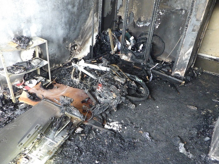 The aftermath of a fire which has destroyed an e-bike