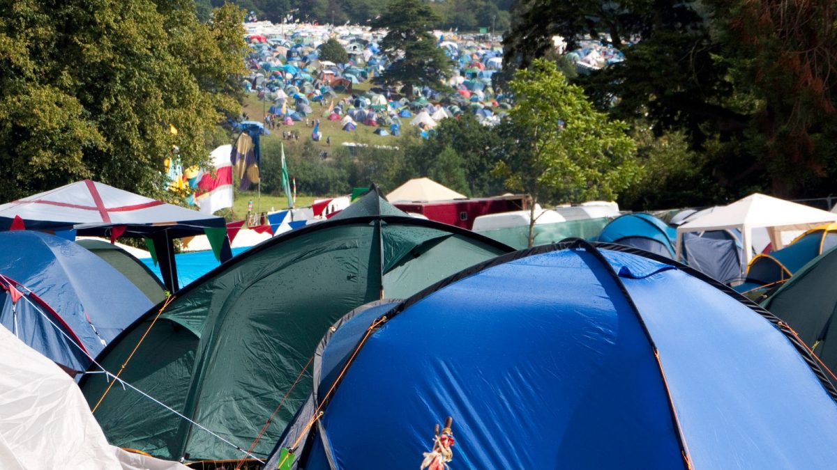 hundreds of tents on a field at a festival