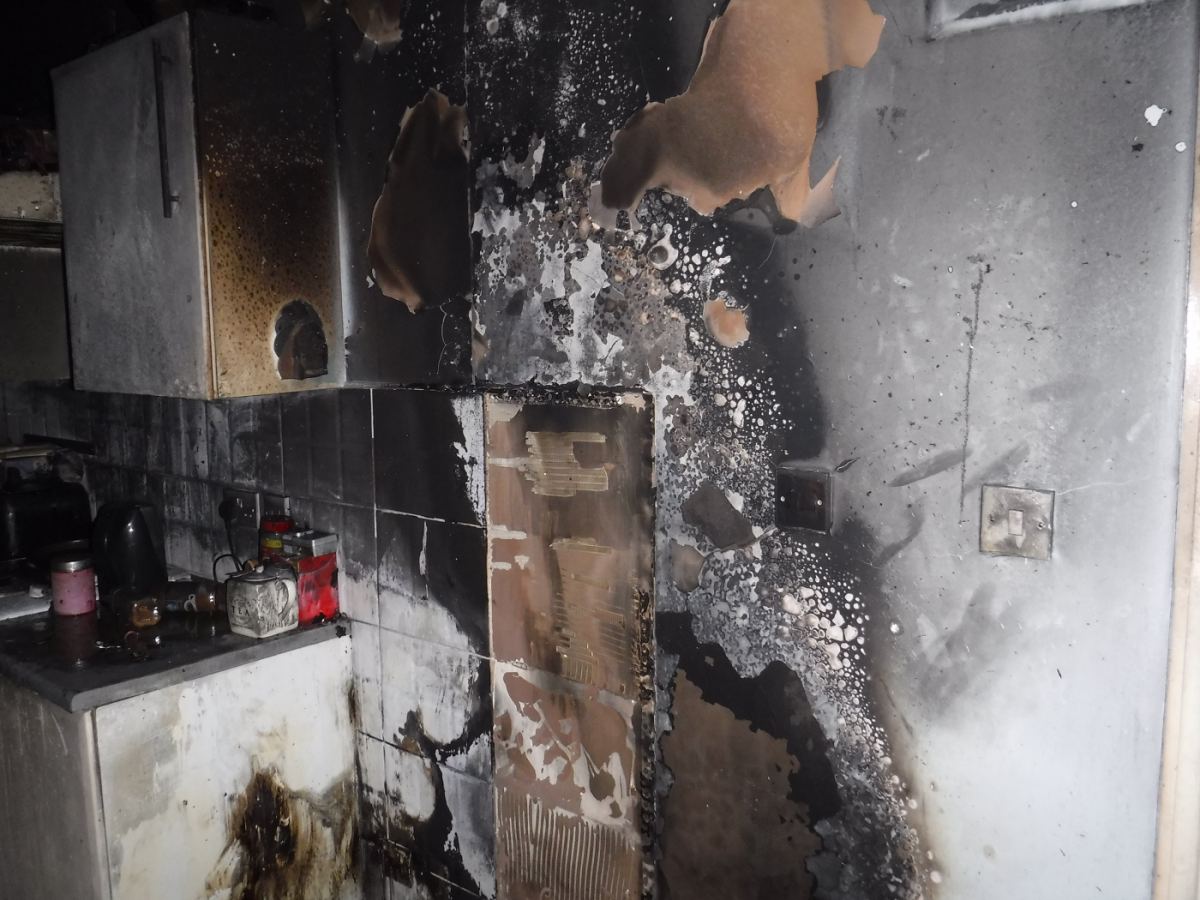 The aftermath of a fire within a kitchen