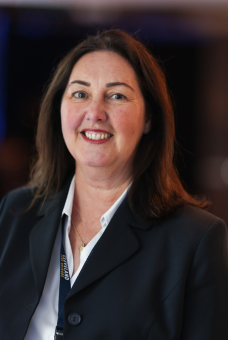 A headshot image of nicola smiling at the camera